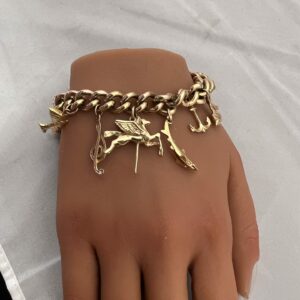 Heavy 9ct gold vintage charm bracelet