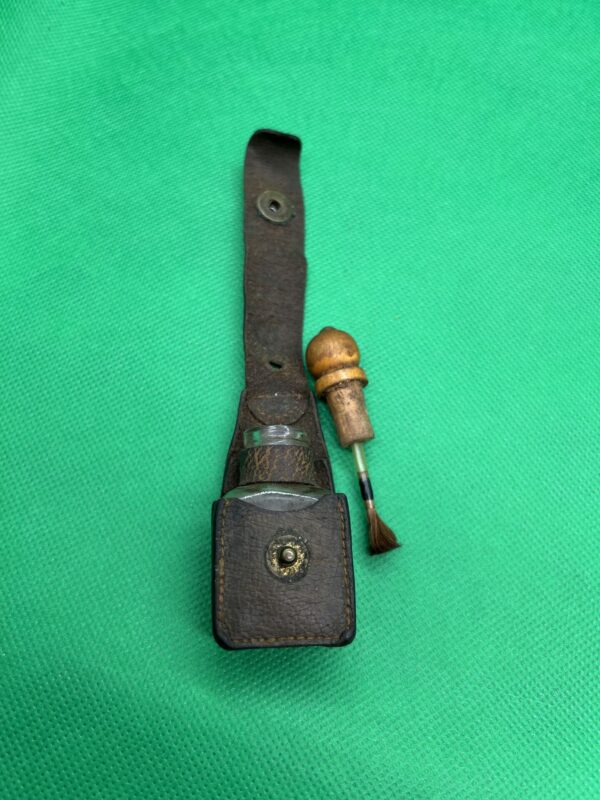 Antique dry fly fluid bottle leather bound
