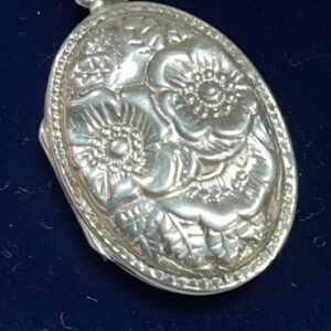 Large silver locket floral decoration