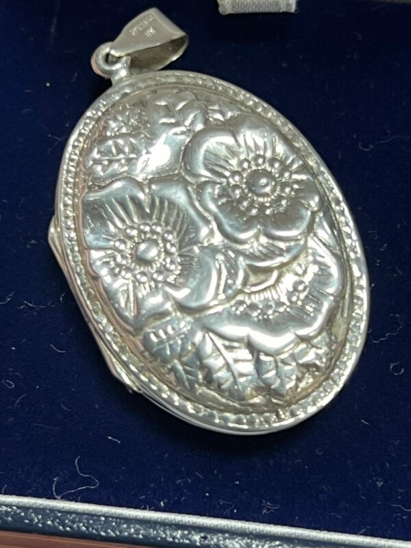 Large silver locket floral decoration