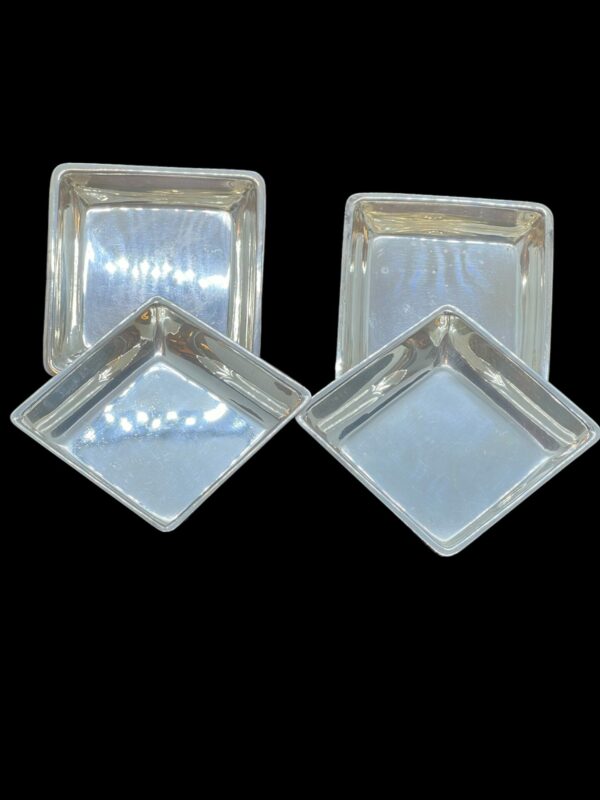 Four asprey of London square silver dishes