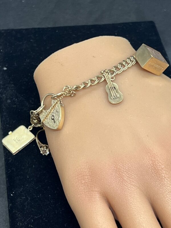 Vintage 9ct gold charm bracelet with charms