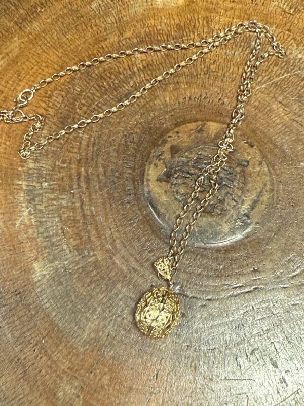 14ct gold egg pendant with 9ct chain