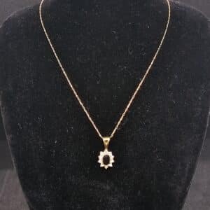 Sapphire and cz pendant and 9ct gold chain